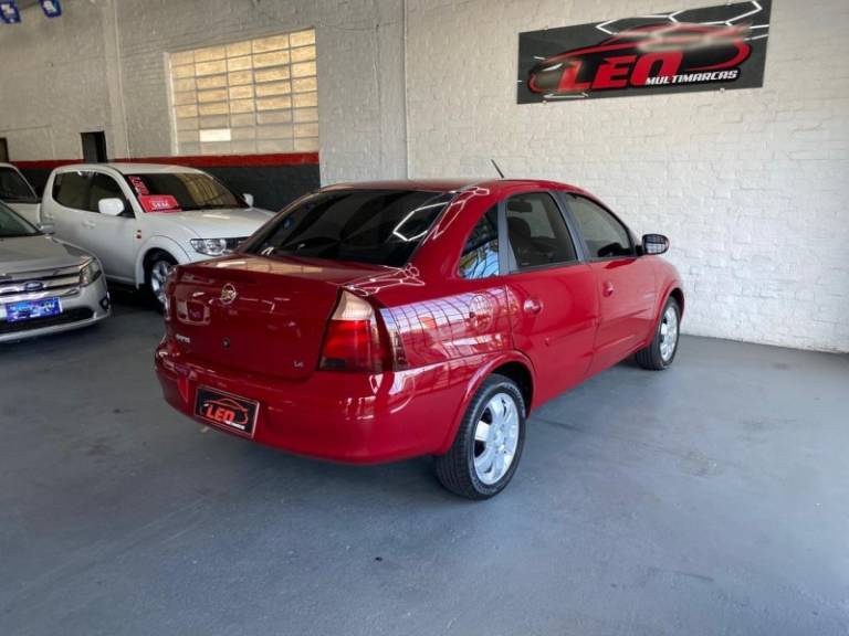 CHEVROLET - CORSA - 2009/2010 - Vermelha - R$ 30.900,00